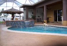 Pool deck is a concrete overlay, with stamped slate coping,